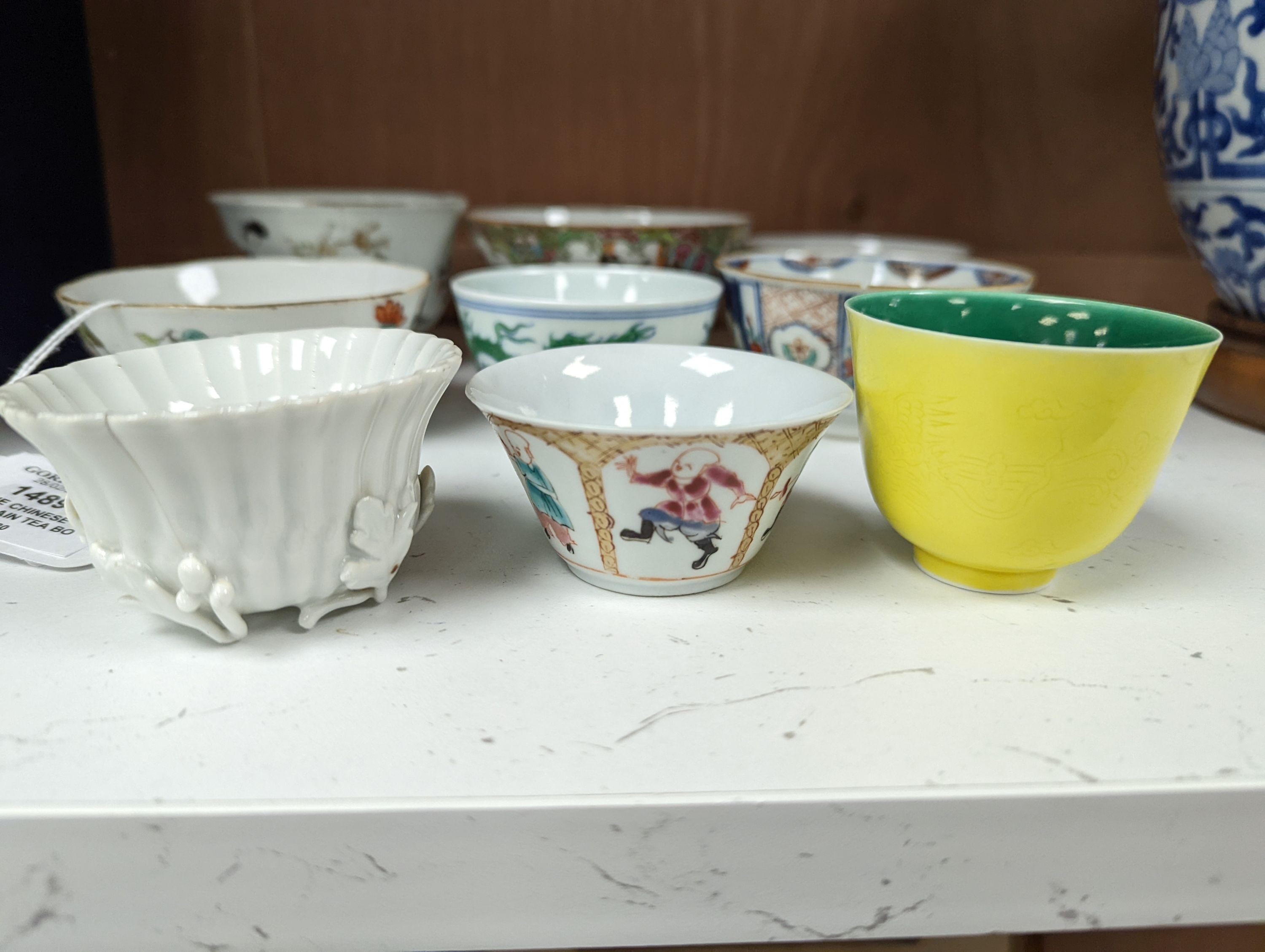 Nine Chinese porcelain tea bowls, tallest 6 cm.